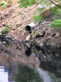 A newly laid rainwater pipe in Budha Nullah