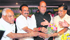 Jagadish Shettar (R) being greeted by BJP leader Rajnath Singh, outgoing Karnataka Chief Minister Sadananda Gowda and BS Yeddyurappa after he was formally elected the BJP legislature party leader, in Bangalore on Tuesday.  PTI