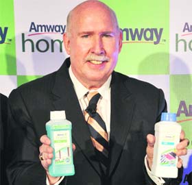 Amway India MD & CEO William S. Pinckney unveils new home care products as well as the $10.9 billion US-based direct-selling multinationals new logo at a press conference in New Delhi on Wednesday