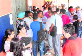Aspirants stand outside the Law Department for the ongoing counselling in Panjab University on Wednesday