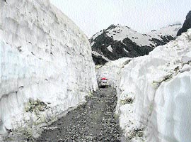 Traffic starts passing through the snowy Saach Pass.
