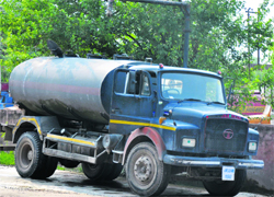 As the PHE Department has stopped issuing new water connections in the city, residents have to depend on tankers for their needs. Tribune photo: Anand Sharma
