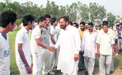 PDP leader Suram Singh shakes hands with the players during the Anu Memorial Cricket Tournament in Jammu on Wednesday. A Tribune photograph
