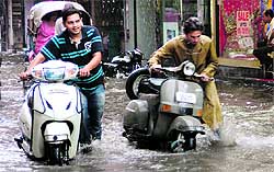 Two-wheelers stuck in rainwater were a common sight after the hour-long rain in Ludhiana on Wednesday