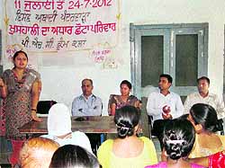 A speaker addresses the gathering during an awareness generation campaign at the primary health centre in Kum Kalan on Wednesday