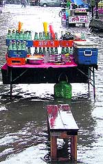 A stall selling local soft drinks is inundated in the Old GT Road area of Ludhiana