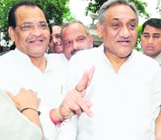 Uttarakhand Chief Minister Vijay Bahuguna talks to mediapersons after his arrival from Sitarganj in Dehradun on Thursday.