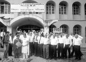 Members of the District Bar Association raise slogans outside the court in Mandi on Thursday