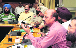 Commissioner, Right to Service Act, Punjab, SM Sharma addresses a meeting of officials in Jalandhar on Thursday. 