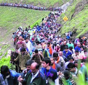 Devotees brave the arduous trek to the Amarnath cave shrine, 130 km south of Srinagar, on Thursday