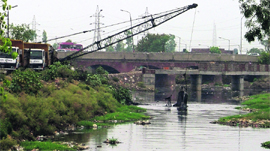 The cleaning of the Budha Nullah under way near the Chand cinema in Ludhiana.