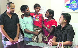 The rescued child along with his parents in Ludhiana on Thursday. 