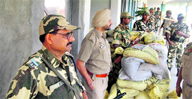 Security personnel stand guard outside the strongroom where EVMs used in the Dasuya byelection have been kept. The counting of votes will be held on July 14.