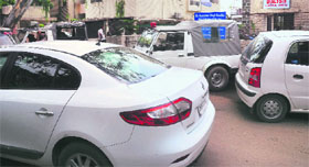 Haphazardly parked cars in front of a dialysis centre at Sector 10 in Chandigarh on Friday.