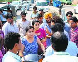 Daughters of the deceased at the accident site near the Zirakpur tax barrier on Friday.