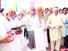 Muslim devotees offer prayers at a religious function of Hazrat Qayam Imam Mehendi organised by Anjumna Farogh-e-aza at Jwalapur in Haridwar on Friday. 
