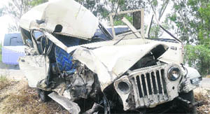 Mangled remains of the police jeep.