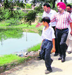 Deputy Commissioner GK Singh inspects an affected area in Patiala on Friday. 
