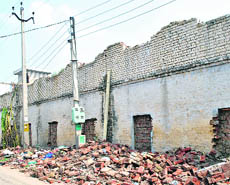 A partially damaged boundary wall of the Government Elementary School inside the Dukhnivaran Sahib gurdwara in Patiala. 