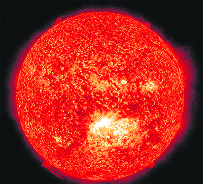 This image provided by NASA shows a solar flare (lower centre) erupting from the Sun on Thursday. Space weather scientists said there should be little impact of these flares on the Earth. The flare erupted from a region which rotated into view on July 6. 