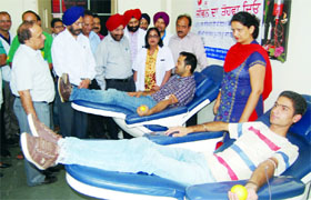 Youths donate blood during a camp organised at the Civil Hospital in Amritsar on Saturday.