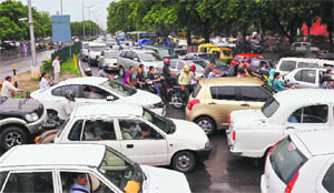 A file photo of traffic chaos near the Grain Market light point on Madhya Marg in Chandigarh. 