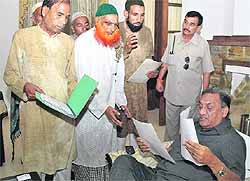 Chief Minister Vijay Bahuguna listens to the problems of people during a janta darbar at his house in Dehradun on Saturday