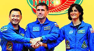 Akihiko Hoshide, Yuri Malenchenko and Sunita Williams at the Baikonur cosmodrome in Kazakhstan