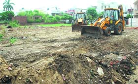 A Municipal Corporation team uses JCBs to recover a park land at the Green Park locality in Jalandhar on Saturday