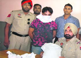 Surjit Singh in the police custody in Jalandhar on Saturday