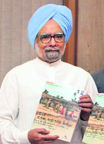 PM Manmohan Singh releases MNREGA Sameeksha in New Delhi on Saturday.