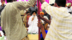 Workers try to fix a tent that collapsed during the Chief Minister's sangat darshan in Muktsar.
