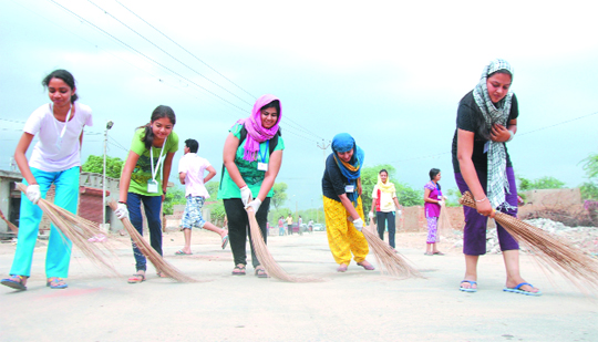 Volunteers of the Art of Living engaged in a cleanliness drive in Bathinda on Saturday.