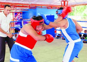 Boxers in action during a match at SD School in Sector 32, Chandigarh, on Sunday
