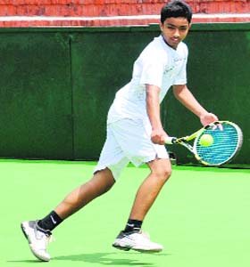 Sachit Malhotra returns a backhand during a final qualifying match at the CLTA courts, Sector 10, Chandigarh, on Sunday