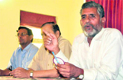 Diwakar Bhatt, president of the UKD (D), addresses mediapersons in Dehradun on Sunday. 