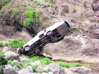 The mangled remains of the private bus which fell into a gorge at Kangra on Saturday night.