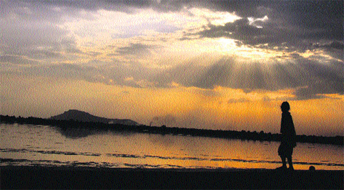 A local enjoys a stroll on the banks of the Dal Lake in Srinagar. 