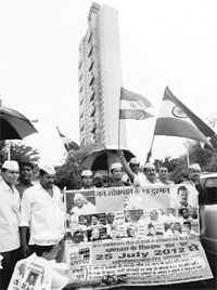 A protest being held in front of the Adarsh building in Mumbai on Sunday