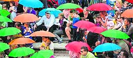 Hundreds of people participate in a sing-along of a nursery rhyme in Windsor on Sunday