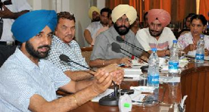 Director General of School Education, Kahan Singh Pannu (first from left) addresses the heads of government schools at a meeting convened in Bathinda on Monday.