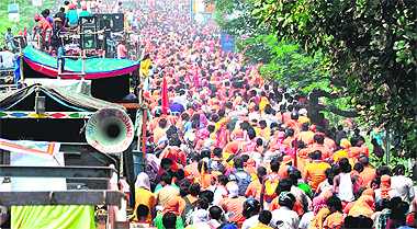 Dak Kanwars leave Haridwar after fetching Ganga water, a day ahead of Shravan Maha Shivratri, on Monday. 