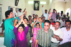 Councillors oppose the hike in house tax during a board meeting of the Dehradun Municipal Corporation in Dehradun 