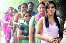Devotees line up at Tapkeshwar Mahadev Temple in Dehradun on Monday.