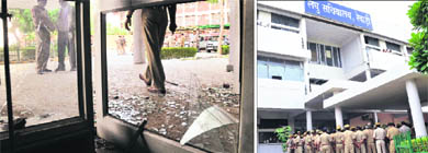 The vandalised secretariat at Rewari on Monday; and (right) a heavy police force deployed to maintain law and order. 