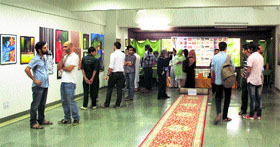 Locals at the art exhibition in Srinagar.