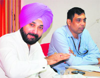 Member of Parliament Navjot Singh Sidhu addresses a meeting of the Airport Advisory Committee in Amritsar on Monday.