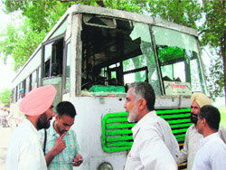 A bus that was damaged by the protesters