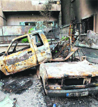 A view of destroyed vehicles in Homs.