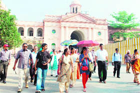 A delegation of tourist guides from Chennai and their families take part in the Heritage Walk in Amritsar on Tuesday. 
